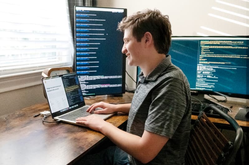 Noah del Angel at his desk